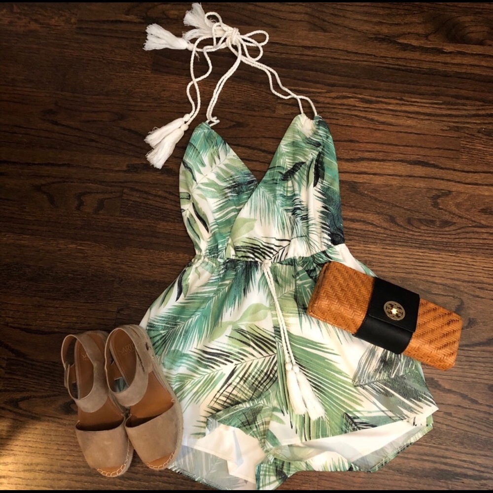 Palm print romper with tassels.